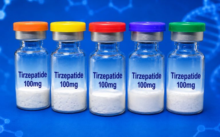 Five Tirzepatide 100mg peptide vials on a blue laboratory background